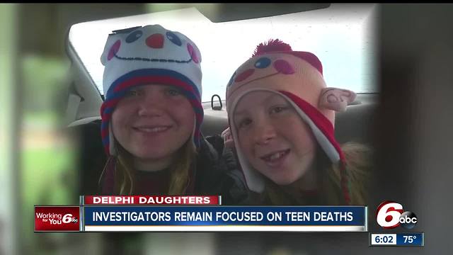 Delphi neighbors use orange lights, flyers to help detectives find the murderer of two Delphi girls