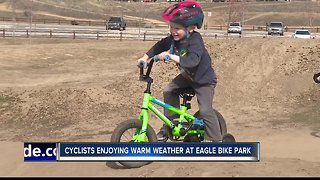 Cyclists enjoying warm weather at bike park