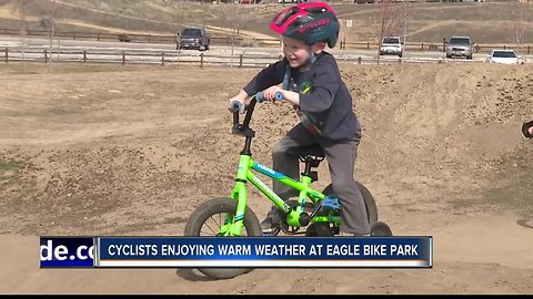 Cyclists enjoying warm weather at bike park