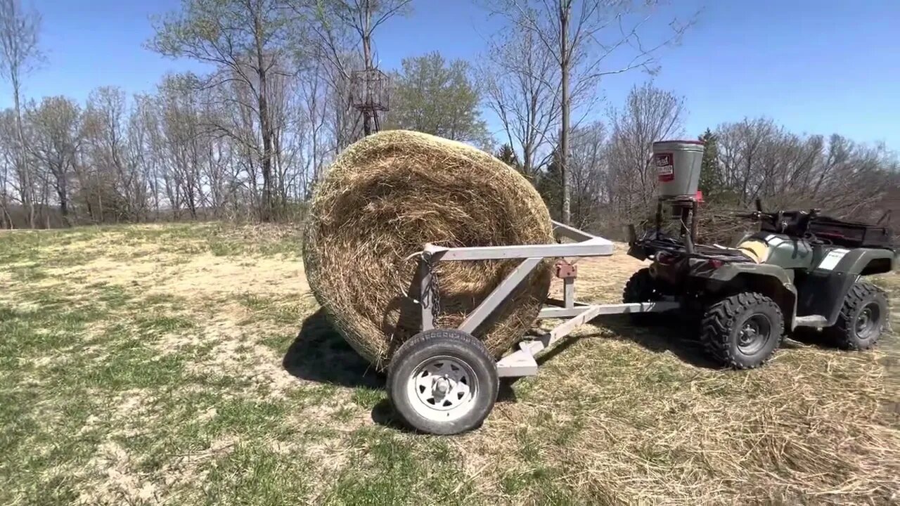 Greg is broadcast seeding and mulching behind the skid steer work.