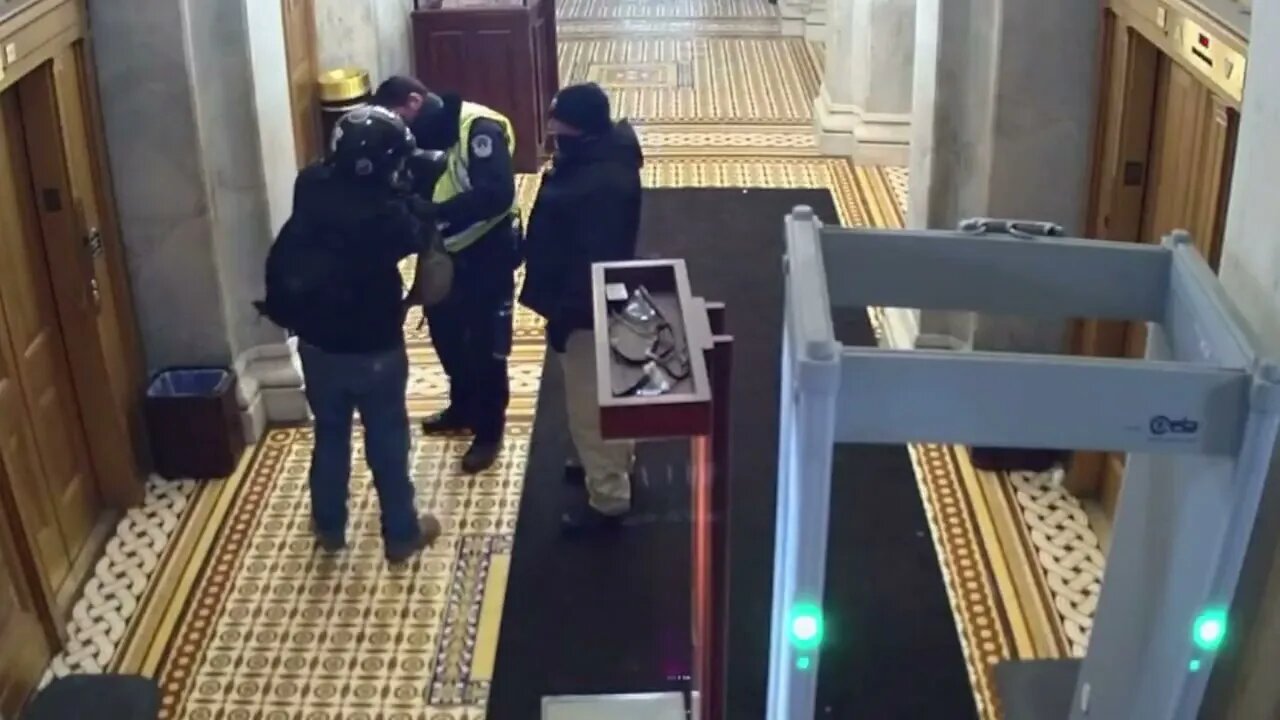 January 6 video they've never shown the public protester is uncuffed by Capitol police