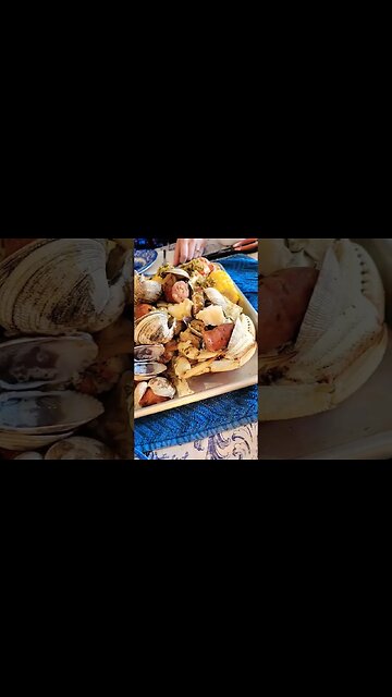 Dungeness Crab, Clams, Cod, Andouille Sausage, and Corn covered in Garlic Butter.