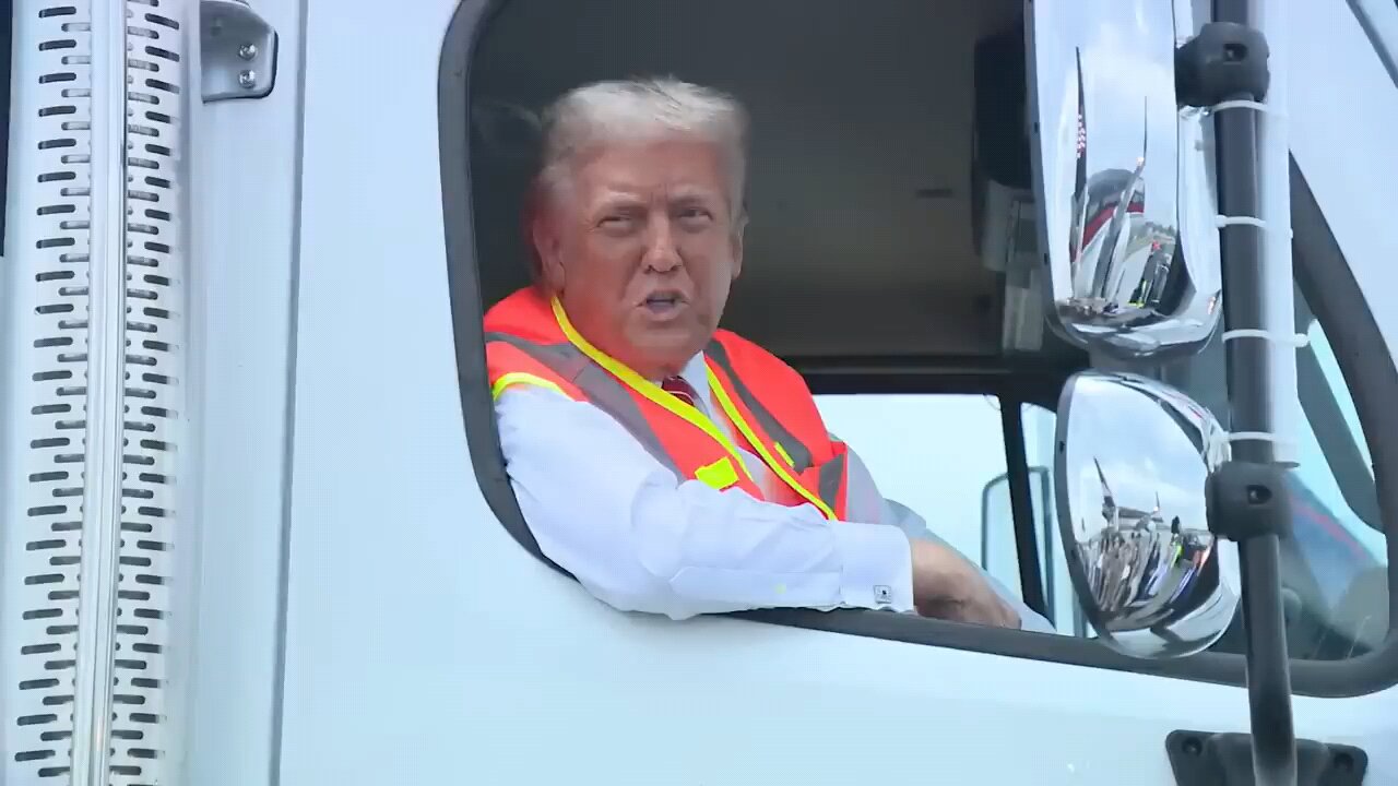 Trump speaks to reporters from garbage truck on campaign trail