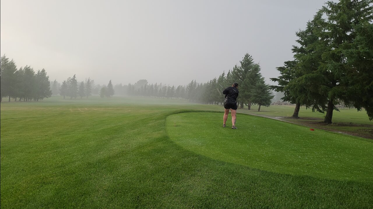 Cassi Golfing in the storm