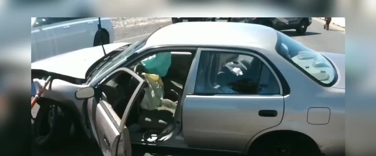 Trooper comforts young girl at scene of crash