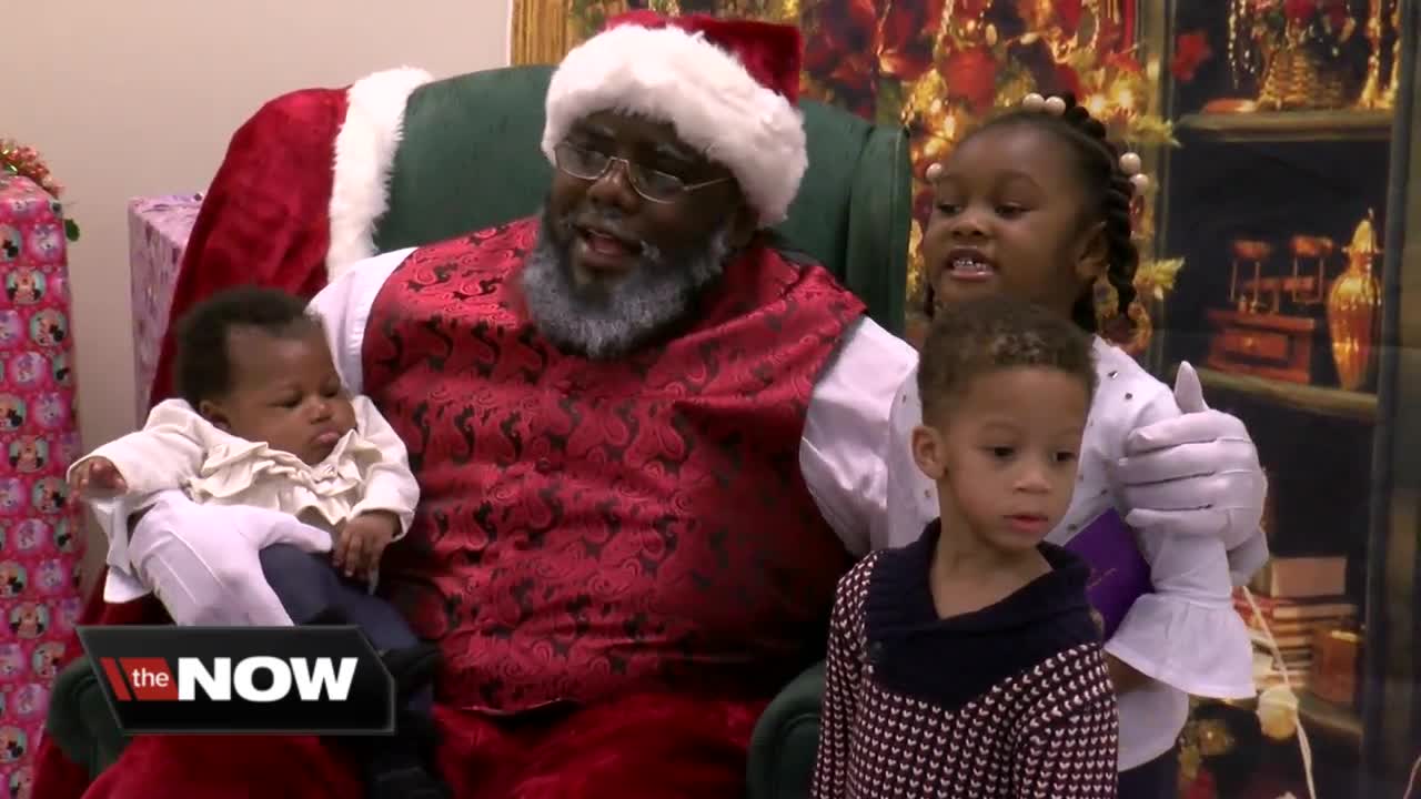 Diverse Santa Claus posing for pictures across Wisconsin