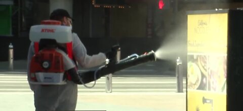 Crews begin fogging Fremont Street in Las Vegas