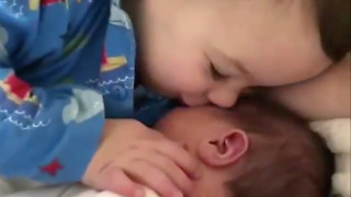 See how toddler cuddles his younger brother