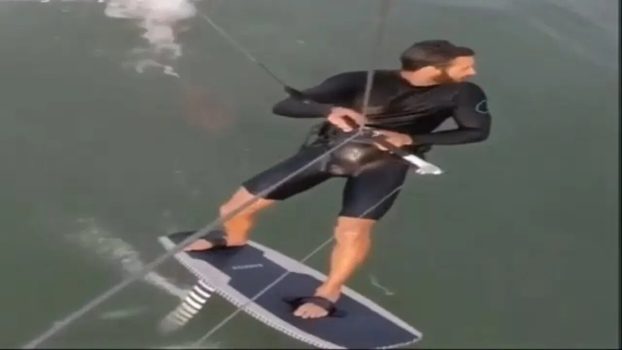 Shocking moment shark CHASES kiteboarder and viciously snaps at his board in terrifying video