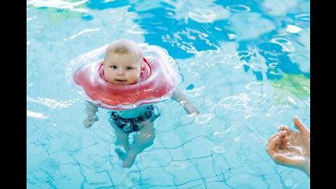 cute little baby swimming in water pool fear less .......