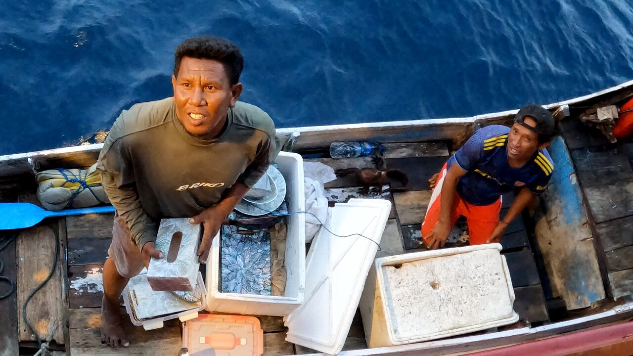 Candid look at life of traditional villager vendor at the boat side in Indonesia