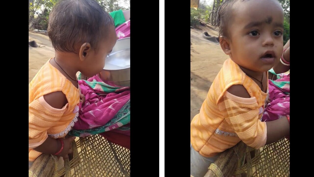 Cute baby drinking rice water. Funny baby.