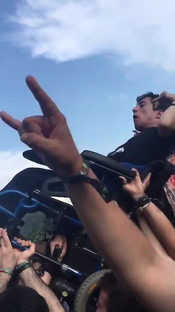 Guy with disability gets crowd surfed at rock concert