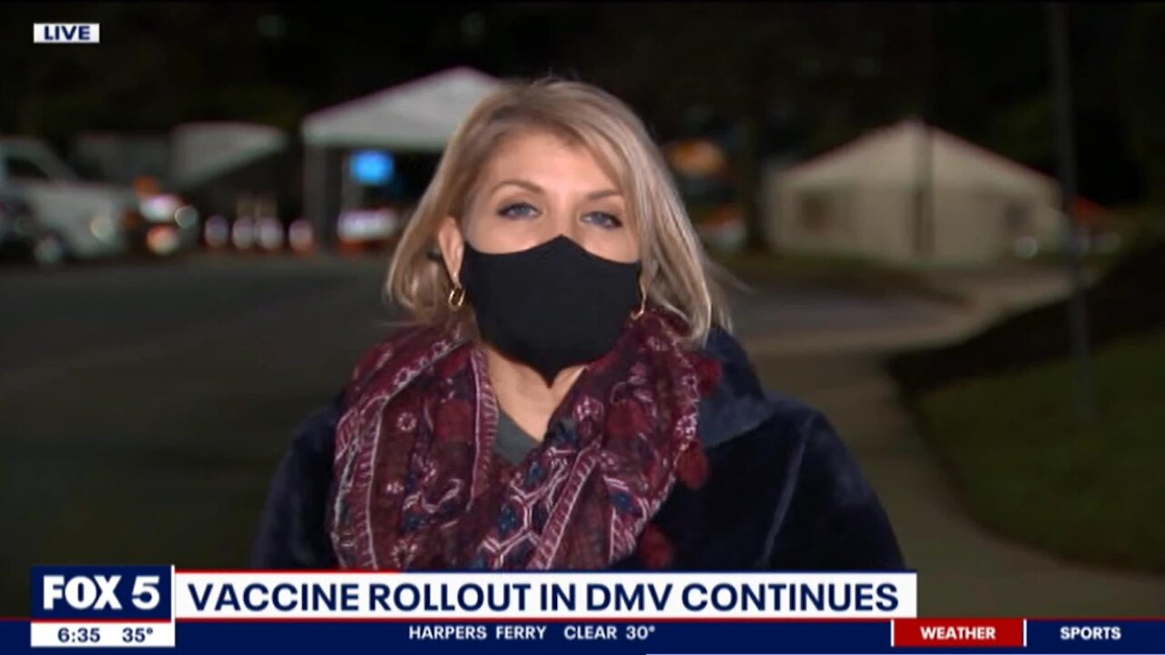 Crazy FOX 5 Melanie Alnwick reports while wearing a mask