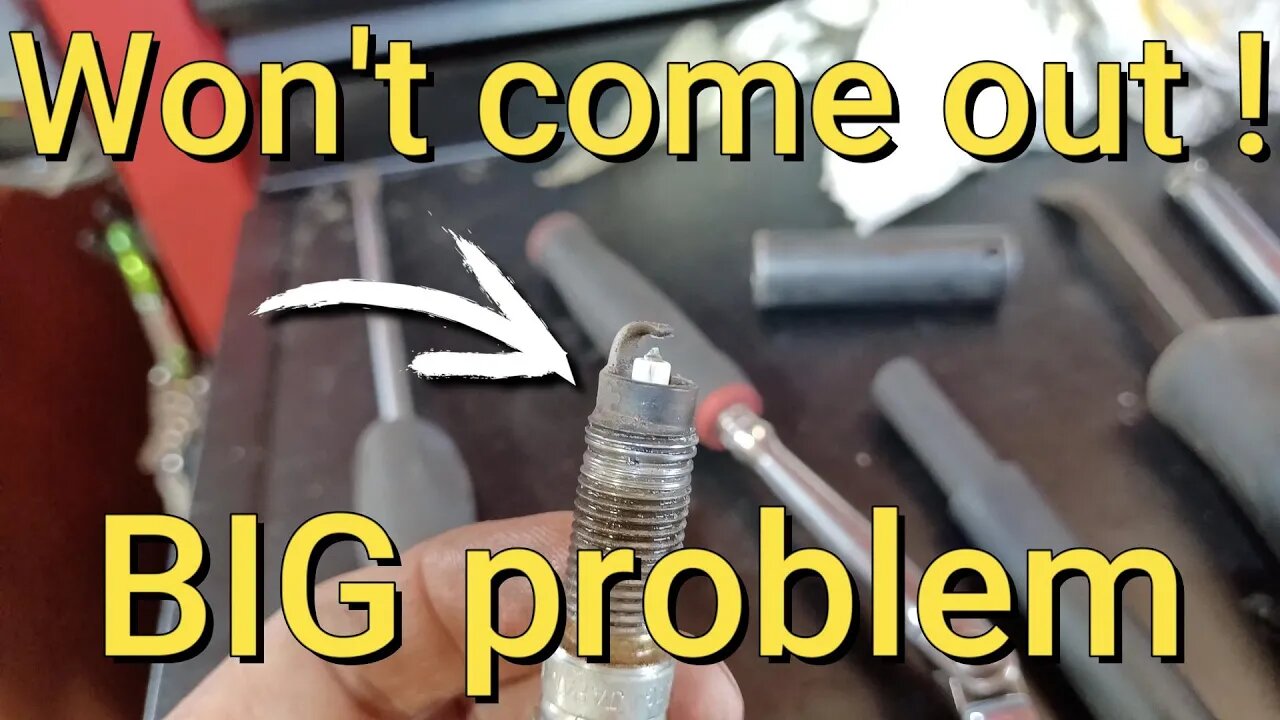 Ford escape stuck spark plug