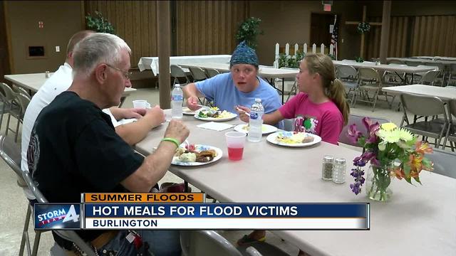 Neighbors serve hot meals to flood victims