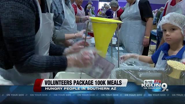 Hundreds of volunteers pack meals for people in need