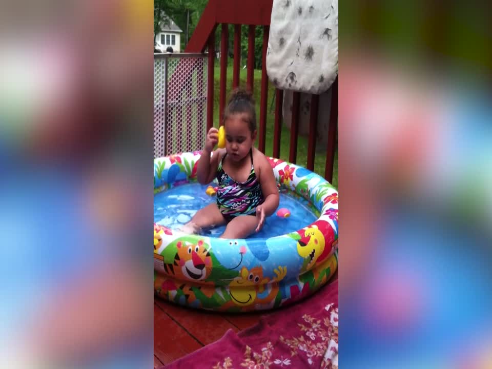 Little Girl Talks with Rubber Ducky