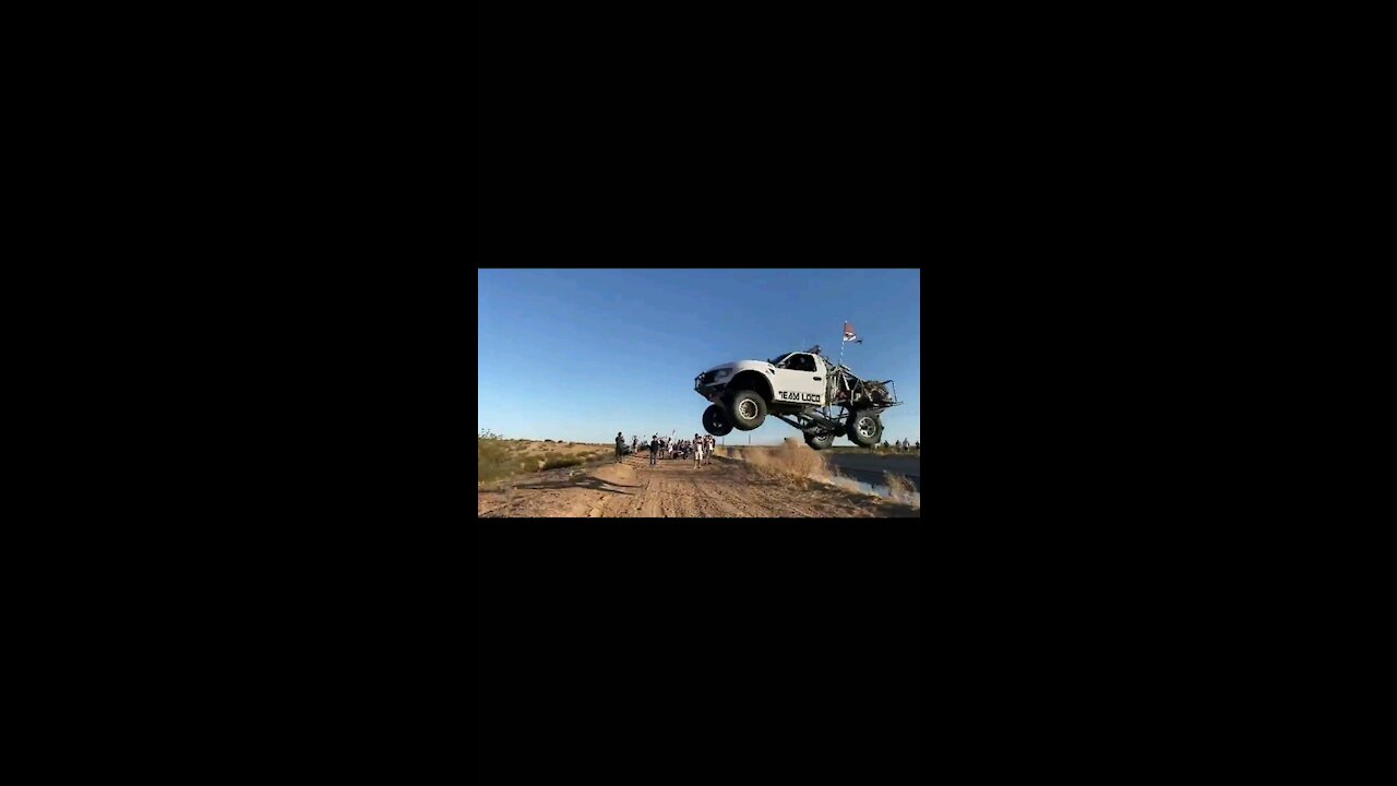 Truck attempts jump across canal.