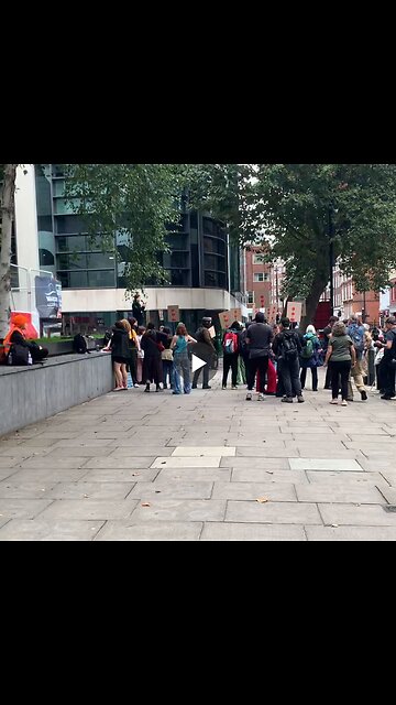 Masked London far-left protesters led by someone with an American accent...