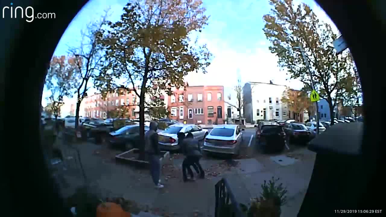 Video captures woman being attacked, robbed outside Patterson Park home