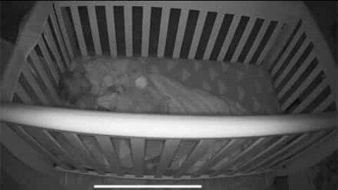 Mysterious light hovers over sleeping baby's crib