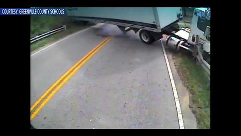 Dramatic video shows tractor-trailer hit school bus carrying special needs student