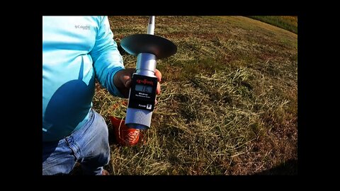 Testing Hay Field Moisture.