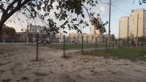 October day at Troeschina, Kiev, children play soccer