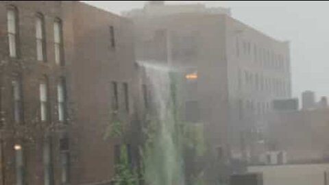 Storm creates huge waterfall on building