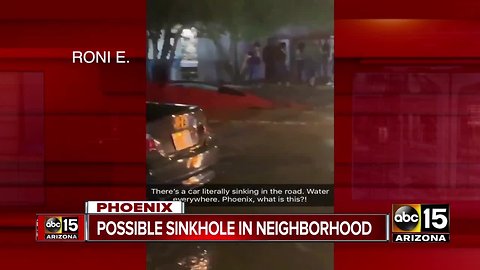 Sinkhole forms after car crashes into fire hydrant