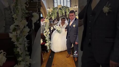 Bride and dad walk down the aisle