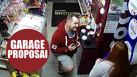 CCTV footage has captured the workplace proposal of a nervous service station assistant