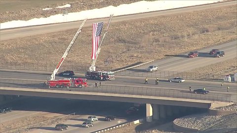 Raising a flag on the highway for Cpl.