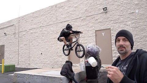 Jumping over a homeless man in the rain!!