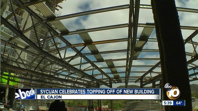 Sycuan celebrates topping off of new building