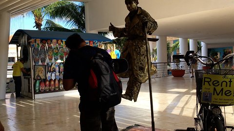 Spectators can't understand how street magician is floating