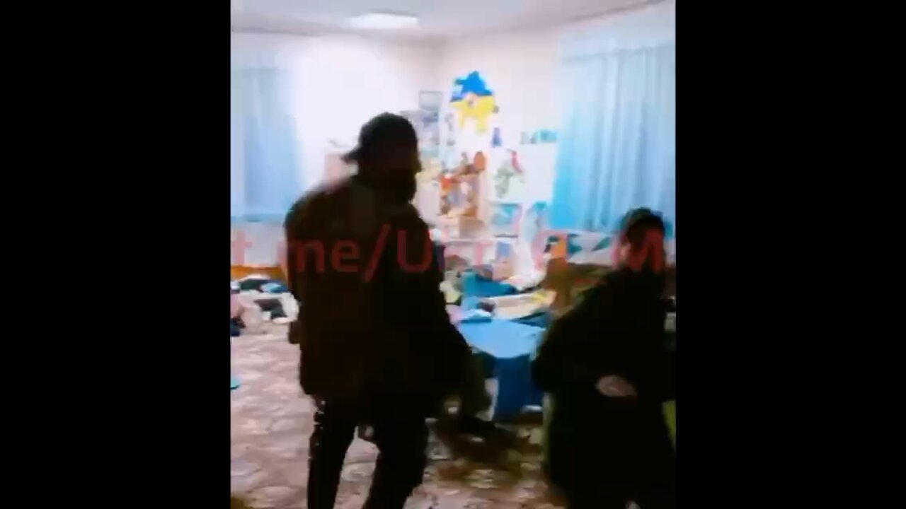 Ukrainian troops dancing around in a young children's school