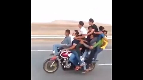 Many friends are traveling together on a motorbike.