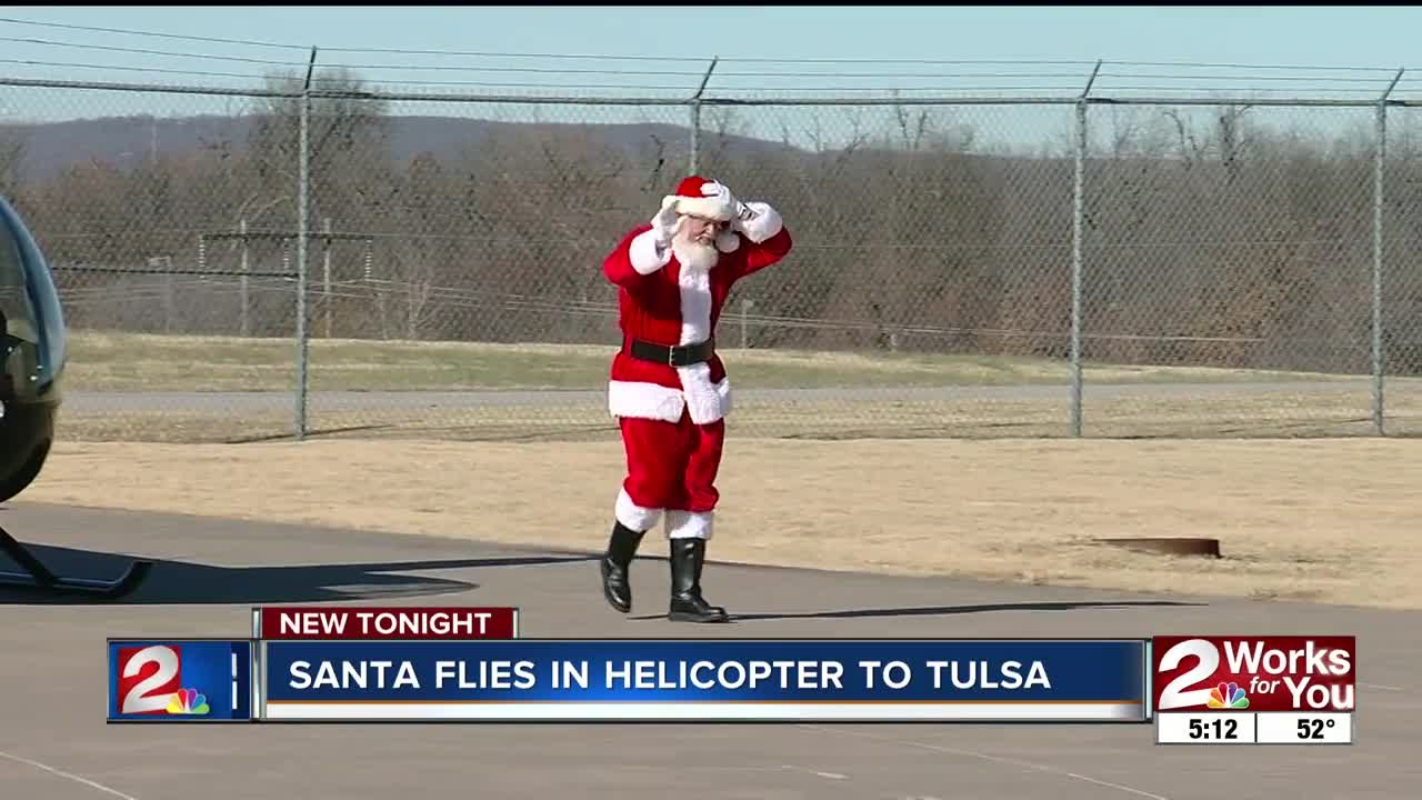 Santa leaves sleigh at North Pole and arrives in helicopter at Tulsa's Air and Space Museum