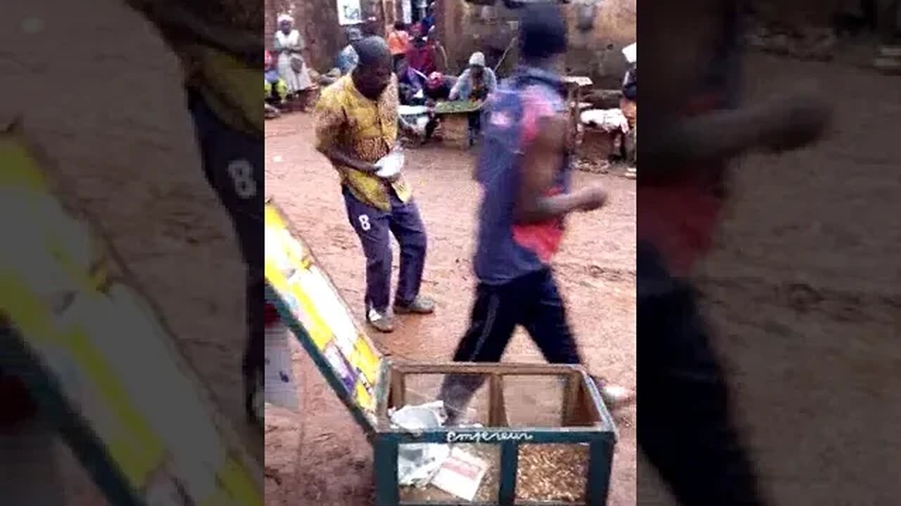 A Masterful Street Vendor of Artisanal Delights of Fried Peanuts and Corn