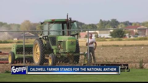 Iconic picture of a Caldwell farmer standing for the National Anthem takes on a life of its own