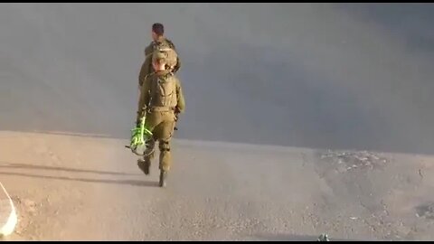 An Israeli soldier confiscated a bicycle from a Palestinian child and threw it into a trash can