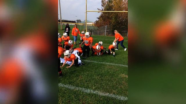 Kid's Football Team Makes Epic Entrance