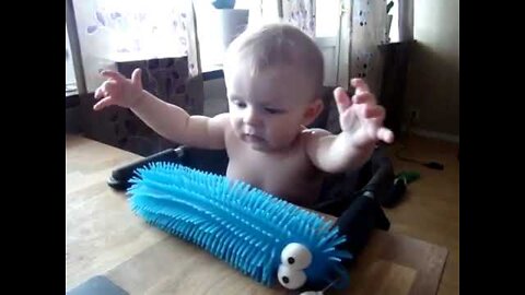 Baby Scares Himself By Touching Toy