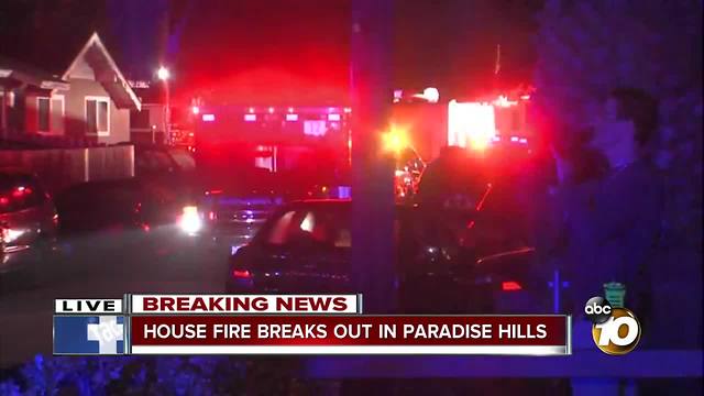 House in Paradise Hills goes up in flames with two people inside