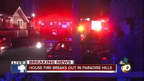 House in Paradise Hills goes up in flames with two people inside