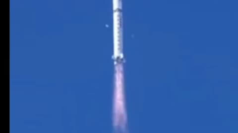 Chinese Rocket dropping white fragments.