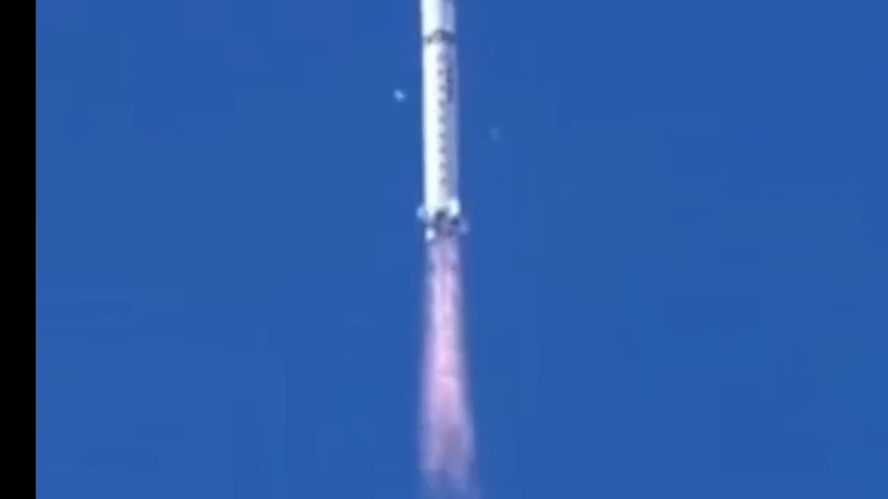 Chinese Rocket dropping white fragments.