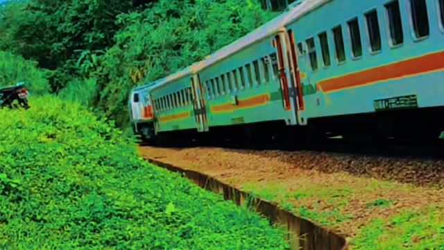 Indonesian train crossing a long bridge aesthetic video